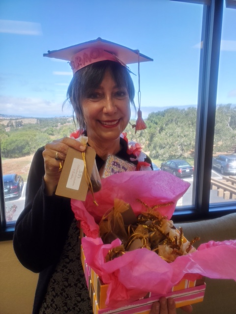 Woman in pink graduation cap